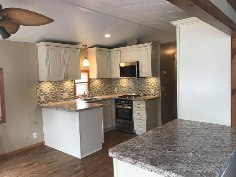 Antique White Cabinets & Mosaic Tile — photograph 1