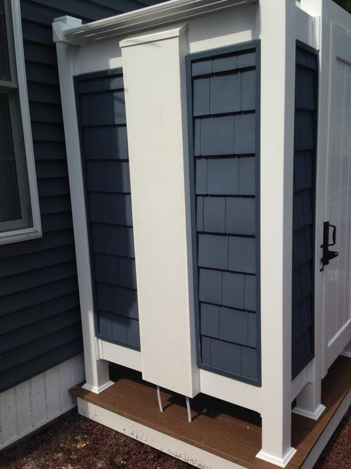 Outdoor Shower with Blue Siding — photograph 4