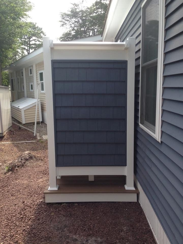 Outdoor Shower with Blue Siding — photograph 3